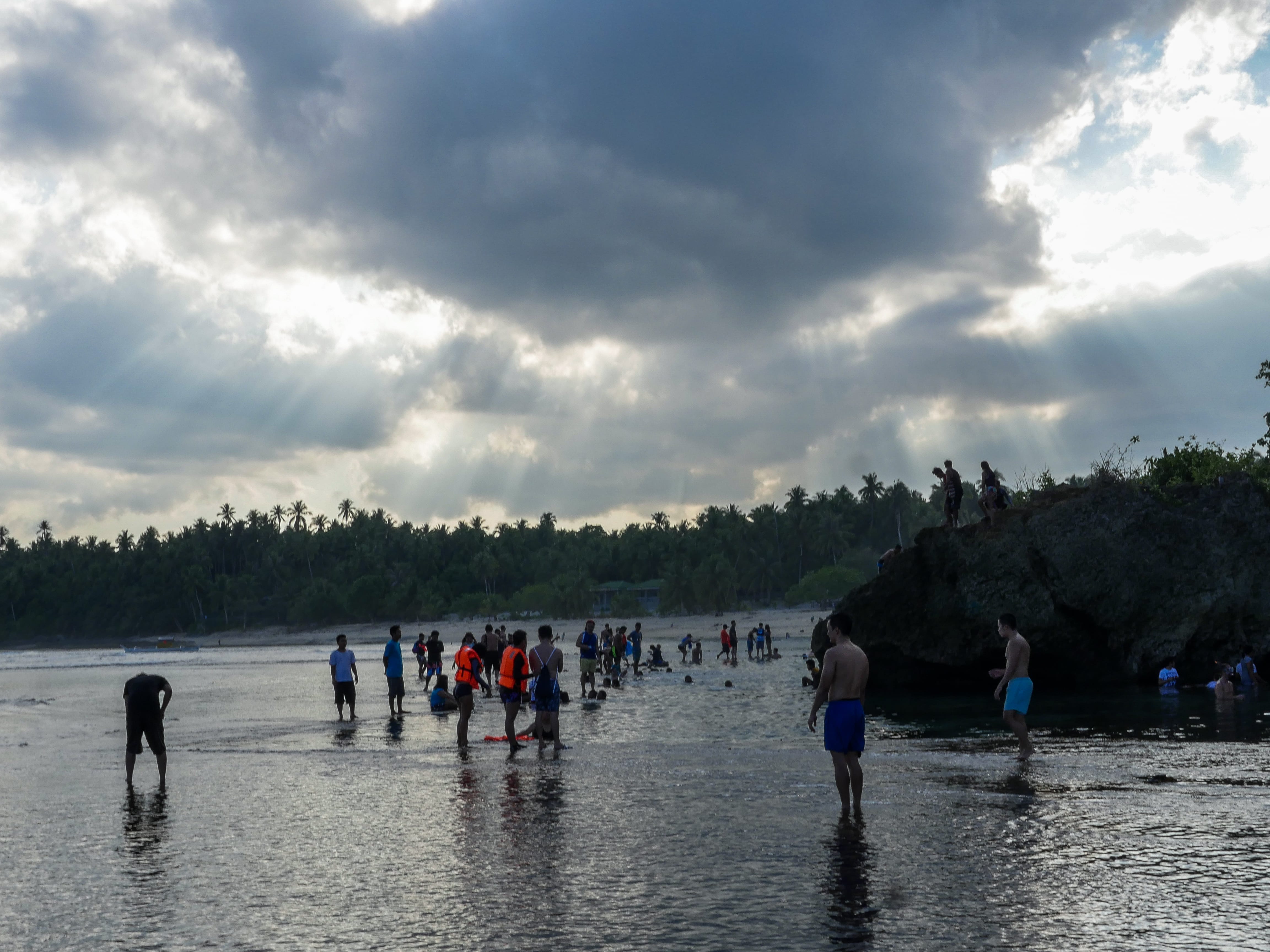 people enjoying at magpupungko tidal rock pools